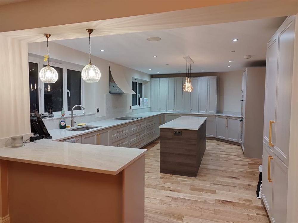 Home kitchen renovation in Milton Keynes — new fitted kitchen with island and pendant lighting